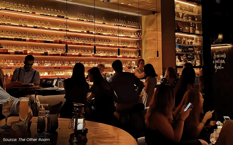 An image of a bar with a bartender