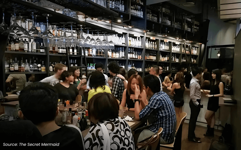 An image of a bar with people
