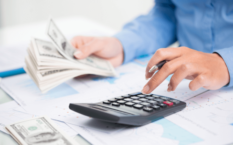 Live Big, Spend Small: A Guide To Saving Money In Singapore Image of a person counting money