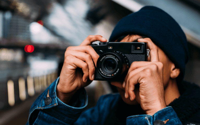 Picture Perfect: 4 Beginner Cameras That Make Learning Easy Image of a person with a camera