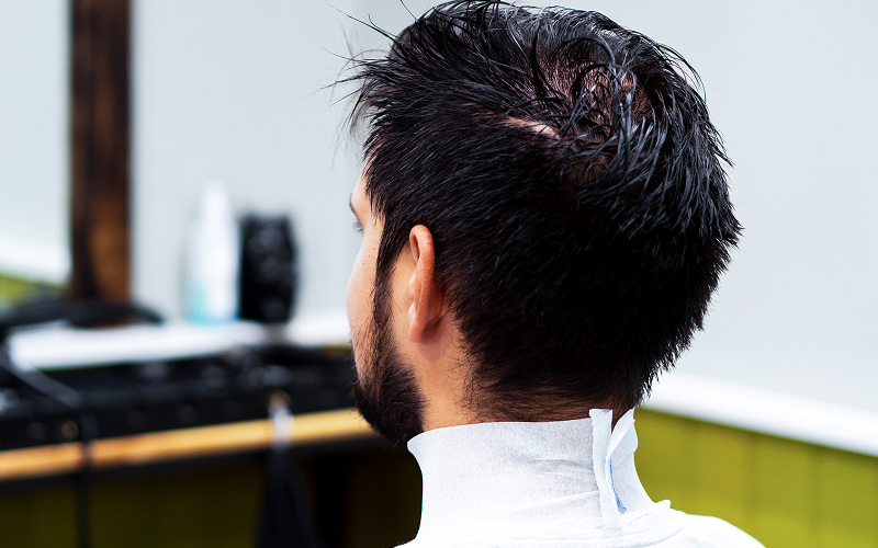 A small-sized stock photo of a classic short back and sides haircut (or a haircut that resembles it).