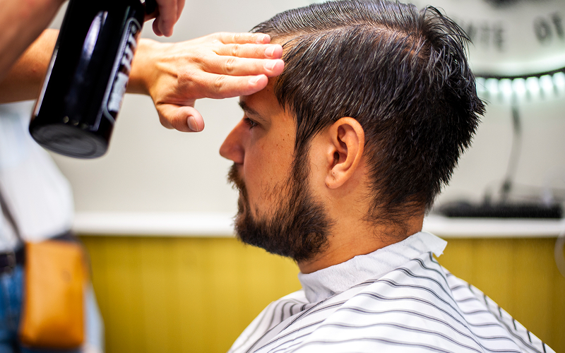 A small-sized stock photo of a side part haircut (or a haircut that resembles it).