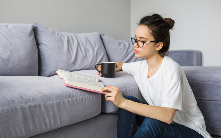 4 Fun Things to Do Indoors When You Want a Break From Screens A person reading a book at home