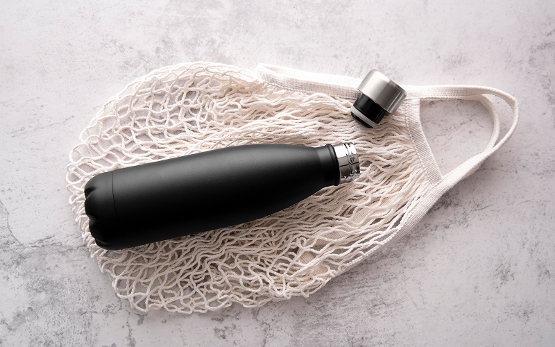 Image of stainless steel bottle and a portable fan
