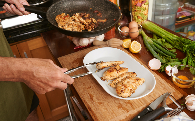 An individual cooking a meal
