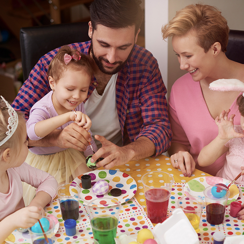 Small image of a family making arts and crafts